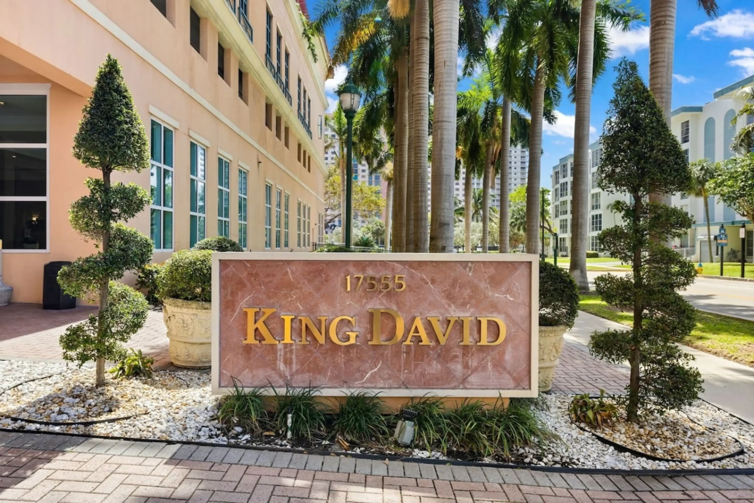 King David condo entrance sign and palm trees